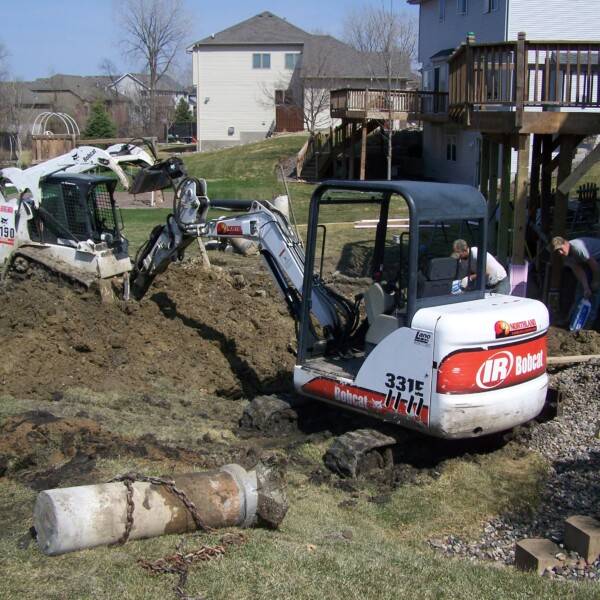 heavy equipment services with backhoe and site work