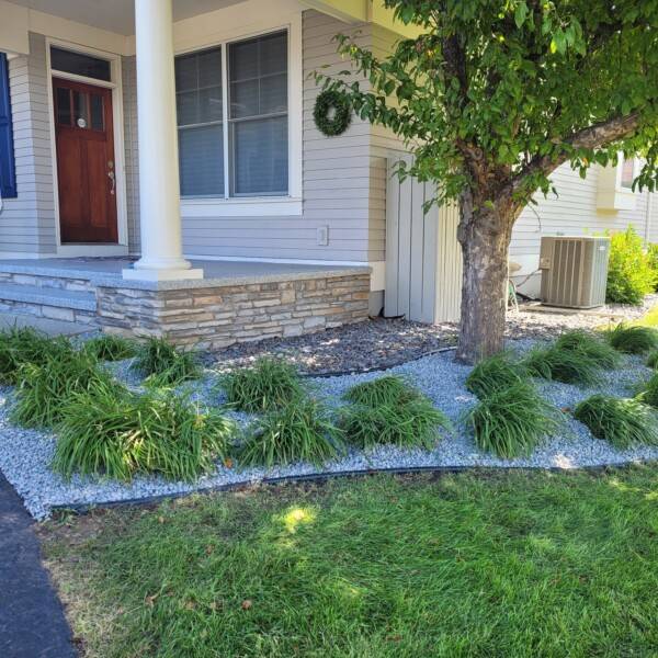 general landscaping with fresh edging and decorative stone